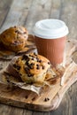 A chocolate chip muffin served with coffee, ready for snacking. Royalty Free Stock Photo