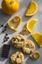 Chocolate chip and orange cookie. Orange peel in heart shape on grey background Royalty Free Stock Photo