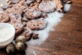 Chocolate chips cookies and scattered peanuts, almonds and pieses of chocolate Royalty Free Stock Photo