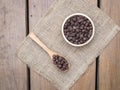 Chocolate chips in wooden spoon and bowl Royalty Free Stock Photo