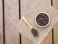 Chocolate chips in wooden spoon and bowl Royalty Free Stock Photo