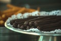 Chocolate churros on a metal fountain