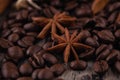 Chocolate, cinnamon sticks  and coffee beans on wooden background Royalty Free Stock Photo