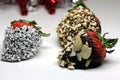 Chocolate coated strawberry with almonds and coconuts