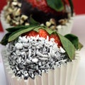 Chocolate coated strawberry with coconut