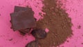 Chocolate, cocoa beans, cocoa powder on a pink background Royalty Free Stock Photo