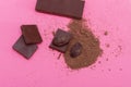 Chocolate, cocoa beans, cocoa powder on a pink background Royalty Free Stock Photo