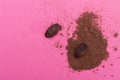 Chocolate, cocoa beans, cocoa powder on a pink background Royalty Free Stock Photo