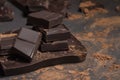Chocolate with cocoa close up powder on grey background Royalty Free Stock Photo
