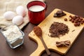 Chocolate, cocoa powder, milk, eggs and flour Royalty Free Stock Photo