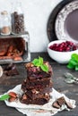 Chocolate brownie with berries and nuts