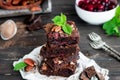 Chocolate brownie with berries and nuts