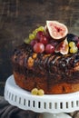 Chocolate coffee cake decorated with fresh fruits Royalty Free Stock Photo