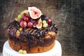 Chocolate coffee cake decorated with fresh fruits Royalty Free Stock Photo