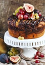 Chocolate coffee cake decorated with fresh fruits Royalty Free Stock Photo