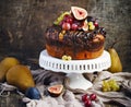 Chocolate coffee cake decorated with fresh fruits Royalty Free Stock Photo