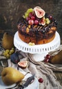 Chocolate coffee cake decorated with fresh fruits Royalty Free Stock Photo