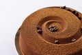 chocolate-coffee cake with grains of coffee on a gold substrate, isolated Royalty Free Stock Photo