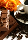 Chocolate, coffee cup, coffee grains and roses Royalty Free Stock Photo
