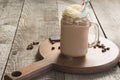 Chocolate coffee milkshake with whipped cream served in glass mason jar on vintage wooden background. Sweet drink. Royalty Free Stock Photo