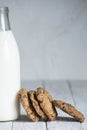 Chocolate coockies next to a bottle of fresh milk. selective focus. text space. handmade biscuits for celebrations Royalty Free Stock Photo