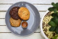 Chocolate cookie and Coffee in glass cup on rustic wooden background. Royalty Free Stock Photo