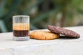 Chocolate cookie and Coffee in glass cup on rustic wooden background Royalty Free Stock Photo