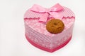 Chocolate cookie and heart shaped pink box with bow Royalty Free Stock Photo