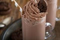 Chocolate cookie milkshake in tall mugs Royalty Free Stock Photo