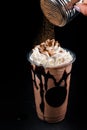 Chocolate cookie milkshake in tall mugs with chocolate whipped cream Royalty Free Stock Photo