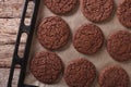 Chocolate cookies on the baking sheet close-up. horizontal top v Royalty Free Stock Photo