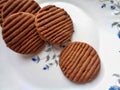 Chocolate cookies or biscuits in white decorative plate Royalty Free Stock Photo