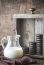 Chocolate cookies with creamy filling with jug of milk Royalty Free Stock Photo