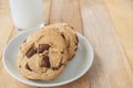 Chocolate cookies and cup of milk on wood table Royalty Free Stock Photo
