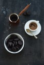 Chocolate cookies with cup and pot of coffee, dark Royalty Free Stock Photo