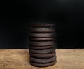 Chocolate cookies filled with cream on wooden board with black background. desserts concept. dark food