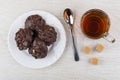 Chocolate cookies with peanuts, teaspoon, cup with tea, sugar cu Royalty Free Stock Photo