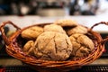 Chocolate cookies on white linen napkin on wooden table. Chocolate chip cookies shot on coffee colored cloth, closeup. Royalty Free Stock Photo