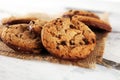 Chocolate cookies on wooden table. Chocolate chip cookies shot on wooden white table Royalty Free Stock Photo