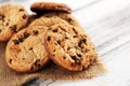 Chocolate cookies on wooden table. Chocolate chip cookies shot on wooden white table Royalty Free Stock Photo