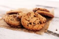 Chocolate cookies on wooden table. Chocolate chip cookies shot on wooden white table Royalty Free Stock Photo