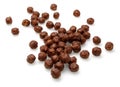 Chocolate corn balls on white background. Cornflakes, cereals