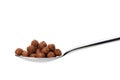 Chocolate cornflakes. A dry breakfast in a spoon. Royalty Free Stock Photo