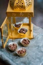 Chocolate Covered Almonds in golden paper cups.