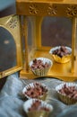 Chocolate Covered Almonds in golden paper cups.