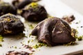 Chocolate Covered Chestnut Dessert with Pistachio Powder. / Kestane Sekeri. Royalty Free Stock Photo