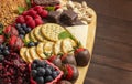 A Chocolate Covered Strawberries and Cheese Sweet Charcuterie Board on a Rustic Wooden Table Royalty Free Stock Photo