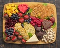 A Chocolate Covered Strawberries and Cheese Sweet Charcuterie Board on a Rustic Wooden Table Royalty Free Stock Photo