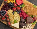 A Chocolate Covered Strawberries and Cheese Sweet Charcuterie Board on a Rustic Wooden Table Royalty Free Stock Photo