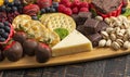 A Chocolate Covered Strawberries and Cheese Sweet Charcuterie Board on a Rustic Wooden Table Royalty Free Stock Photo